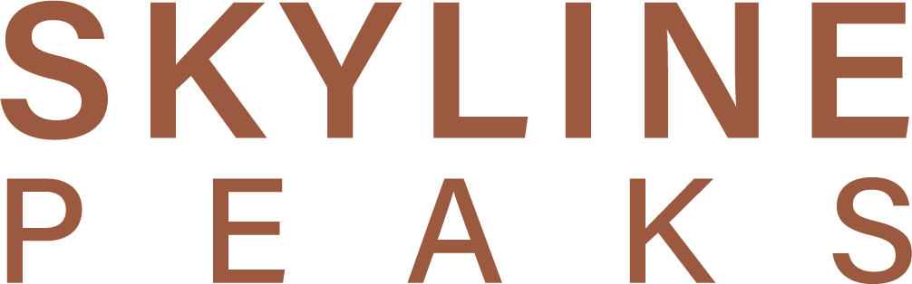 Skyline Peaks logo, one of the properties we help maintain five-star Airbnb host status in Canmore.