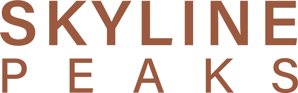 Skyline Peaks logo, one of the properties we help maintain five-star Airbnb host status in Canmore.