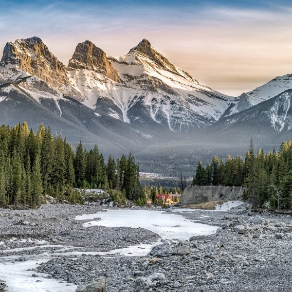The iconic Three Sisters mountains at sunrise, a view known well by the local Airbnb experts at Canmore Co-Host.