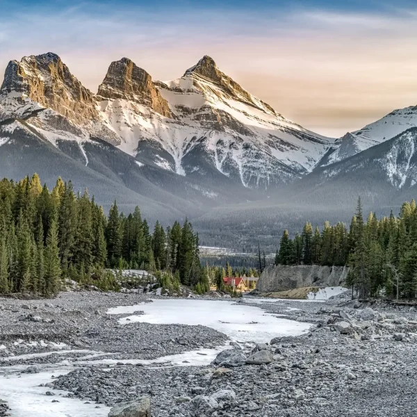 The iconic Three Sisters mountains at sunrise, a view known well by the local Airbnb experts at Canmore Co-Host.